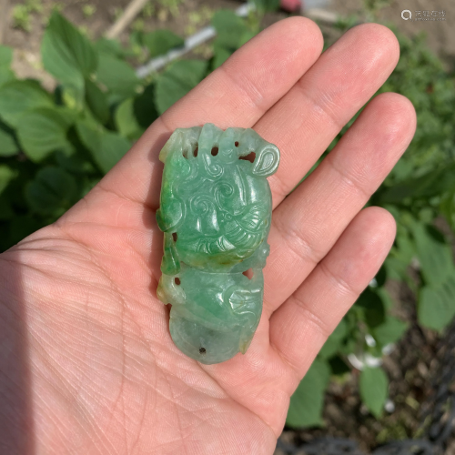 A Jadeite Double Gourd Form Carved Pendant