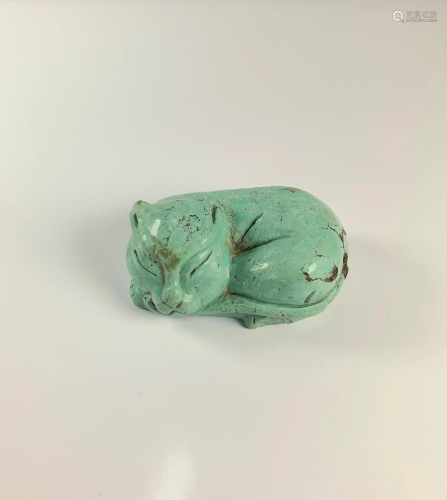 A Turquoise Recumbent Cat