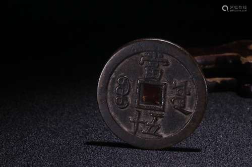 A Chinese Bronze Coin