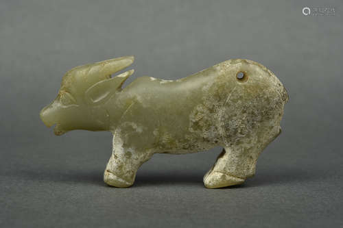 A CELADON JADE BUFFALO SHANG DYNASTY