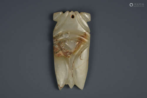 A WHITE AND RUSSET JADE CICADA HAN DYNASTY