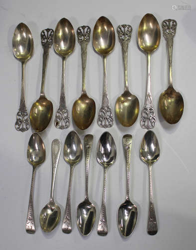 A small collection of silver cutlery, including a set of eight George V dessert spoons with