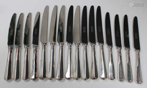 A set of eight Elizabeth II silver handled and steel bladed table knives and eight matching