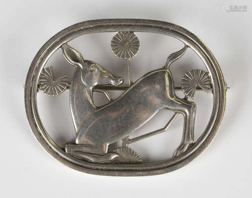 A Georg Jensen sterling silver brooch, designed by Arno Malinowski as a deer with stylized flowers