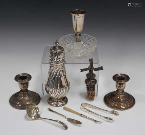 A late Victorian silver sugar caster with pierced dome cover and turned finial, the baluster body