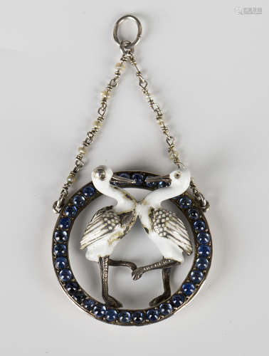 A silver, enamelled and cabochon sapphire pendant, possibly Austro-Hungarian, designed as two storks