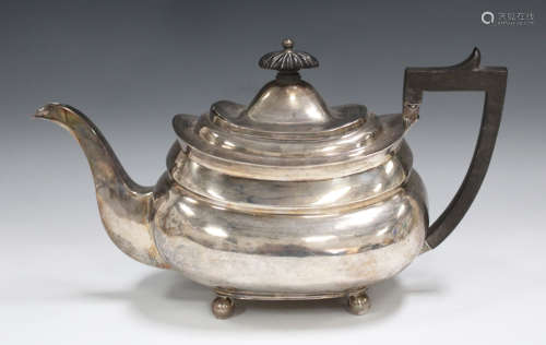 A George III silver teapot of cushion form, on ball feet, London 1814 by Samuel Godbehere & James