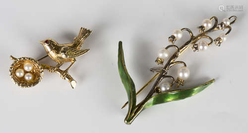 A 9ct gold and cultured pearl brooch, designed as a bird perched on a branch next to a nest, width