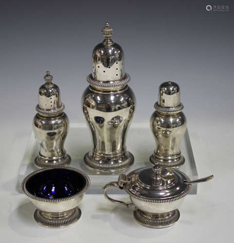 An Elizabeth II silver six-piece condiment set, comprising large sugar caster, pair of smaller