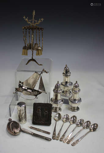 A collection of silver items, including a Victorian cylindrical scent bottle, engraved with birds