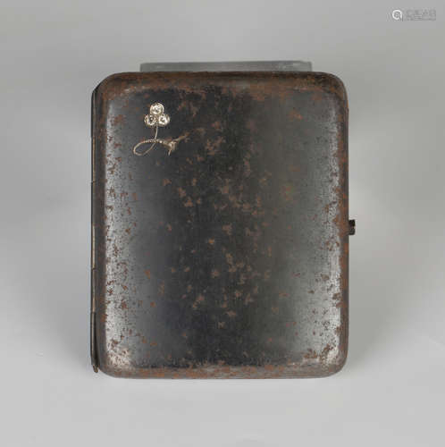 A diamond set iron curved rectangular cigarette case, the front mounted with three principal cushion