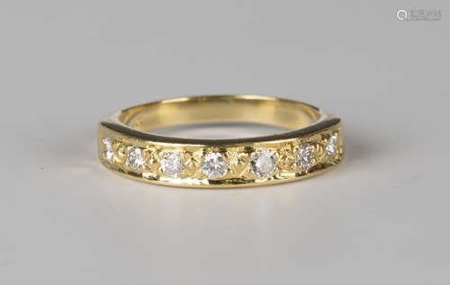 A gold and diamond seven stone half-hoop eternity ring, mounted with a row of circular cut diamonds,