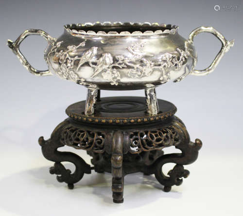 A late 19th/early 20th century Chinese silver two-handled circular bowl with shaped rim, the