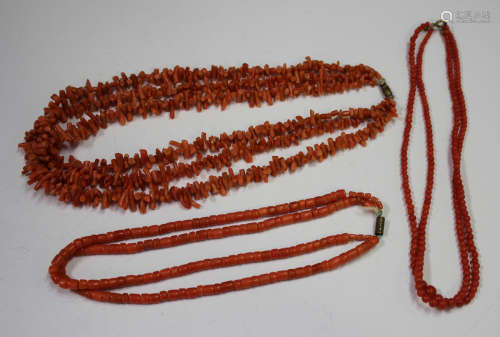 A three-row necklace of graduated branch coral, two two-row necklaces of coral beads, eight mostly