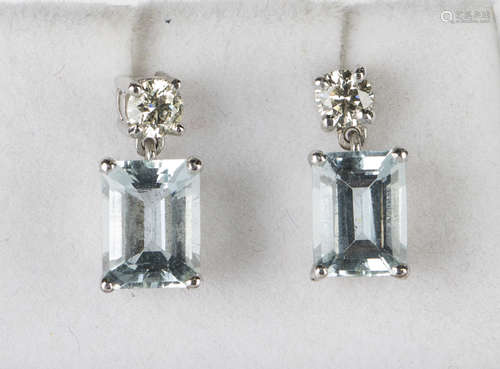 A pair of white gold, aquamarine and diamond pendant earrings, each drop claw set with a rectangular