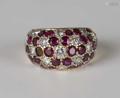 A gold, ruby and diamond bombé ring, mounted with circular cut rubies and diamonds in a floral