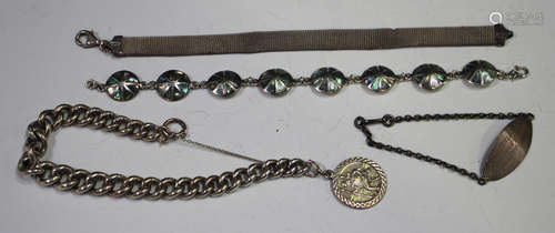 A silver curblink bracelet, fitted with a St Christopher pendant, a silver and abalone shell