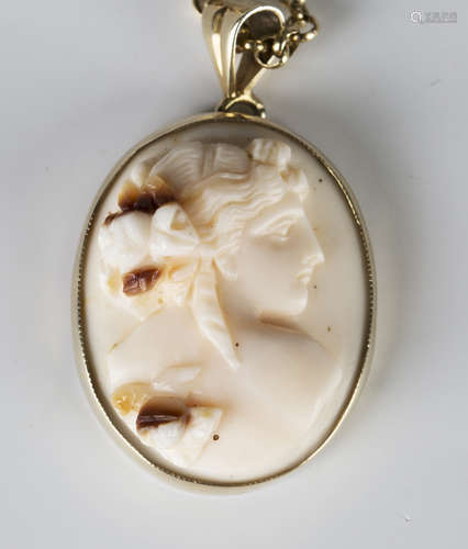 A gold mounted oval shell cameo pendant, carved as a portrait of a lady, length 4cm, with a circular