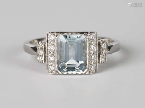 A platinum, aquamarine and diamond ring, collet set with a canted corner rectangular cut