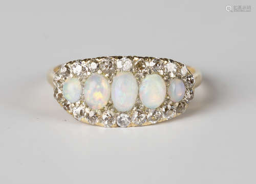 A gold, opal and diamond ring, mounted with five oval opals graduating to the centre within a