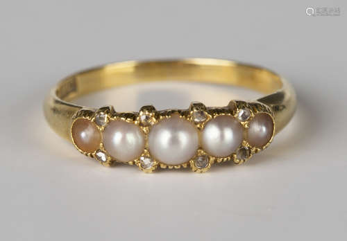 A gold ring, mounted with a row of five graduated half-pearls and four pairs of rose cut diamonds at