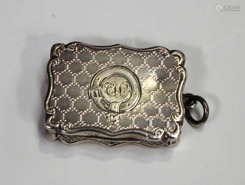 A Victorian silver vinaigrette of shaped rectangular outline with engraved decoration, the gilt