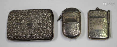 A late Victorian silver vesta case with hinged lid and hinged sovereign compartment, engraved with