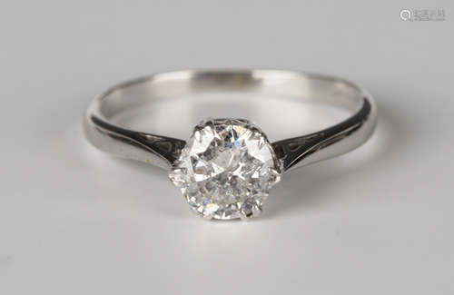 A white gold, platinum and diamond single stone ring, claw set with a circular cut diamond, detailed