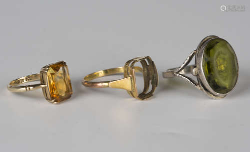 A gold ring, claw set with a cut cornered rectangular citrine, detailed '9ct', ring size approx L,