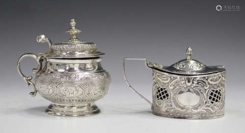 A Victorian silver mustard, the circular baluster body with engraved decoration, the hinged dome lid