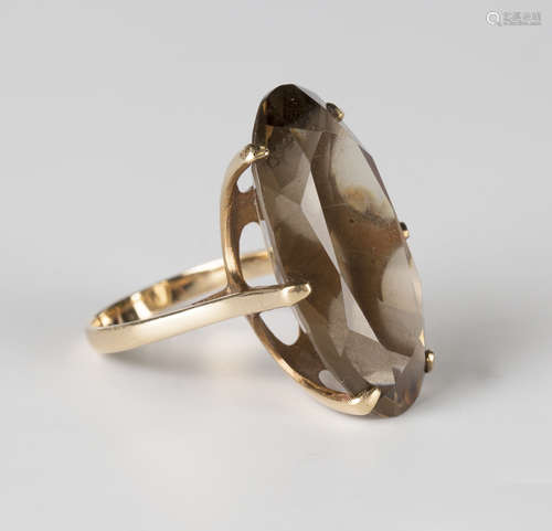 A 9ct gold ring, claw set with an oval cut smoky quartz, Birmingham 1972, ring size approx P1/2.