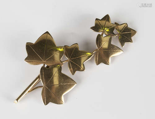 A 9ct gold brooch, designed as a stem of ivy leaves, detailed 'Ivan Tarrant Eng', Birmingham 1962,