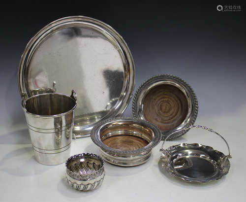 A small group of plated items, including a pair of wine coasters and an ice bucket, together with