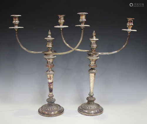 A pair of early 19th century Sheffield plate three-light twin-branch candelabra by Matthew