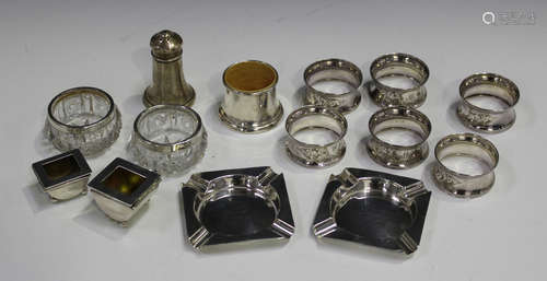 Two silver stamp boxes with hinged lids and ball feet, Birmingham 1900 and 1908, together with six