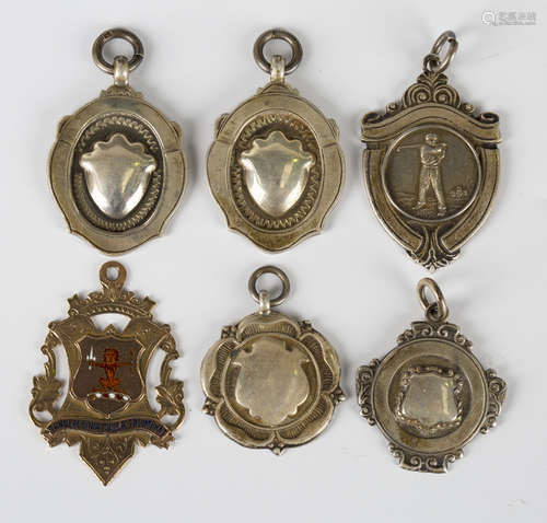 A 9ct gold and enamelled fob medal, Birmingham 1905, and five silver fob medals.Buyer’s Premium 29.