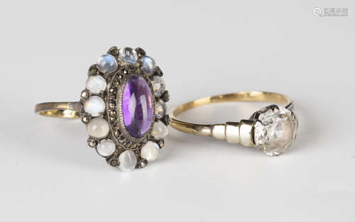 A gold and silver set, cabochon amethyst, marcasite and moonstone oval cluster ring, detailed '9ct',