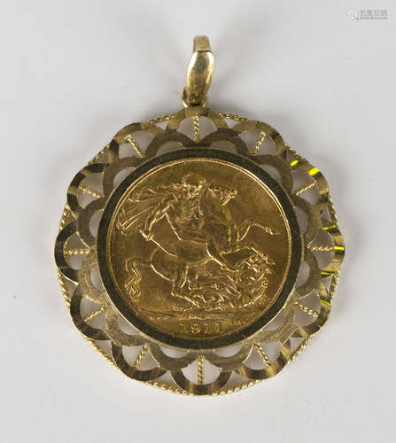 A George V sovereign 1911, in a 9ct gold pendant mount, decorated with a pierced and ropetwist