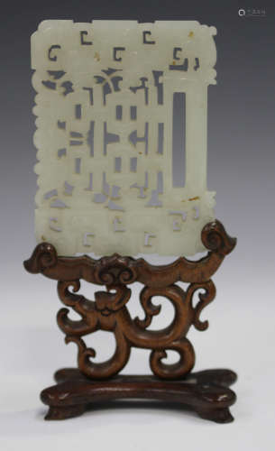 A Chinese pale celadon jade plaque pendant, late Qing dynasty, carved and pierced in the form of a