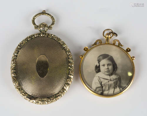 A Victorian gold back and front oval pendant locket, the interior glazed with a locket