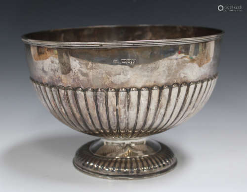 A George V silver rose bowl with half-reeded body and domed foot, London 1910 by William Hutton &