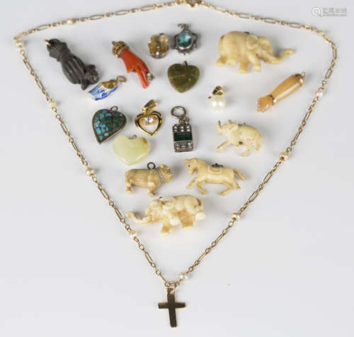 A gold and seed pearl pendant necklace, length 43cm, the front with a cross motif, and seventeen