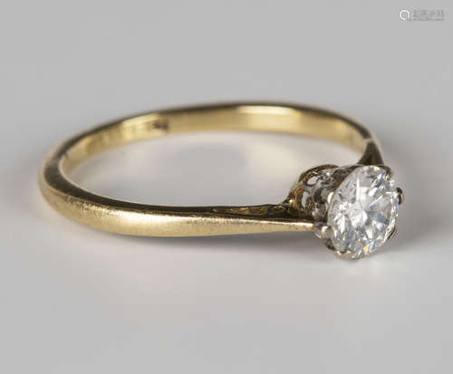 A gold, platinum and diamond single stone ring, claw set with a circular cut diamond, detailed 'Plat