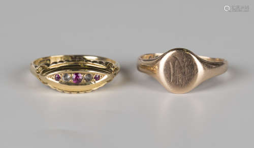 An 18ct gold, ruby and colourless gem set five stone ring in a boat shaped design, ring size