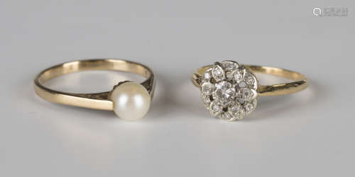 An 18ct gold and diamond cluster ring in a pierced flowerhead shaped design, claw set with the