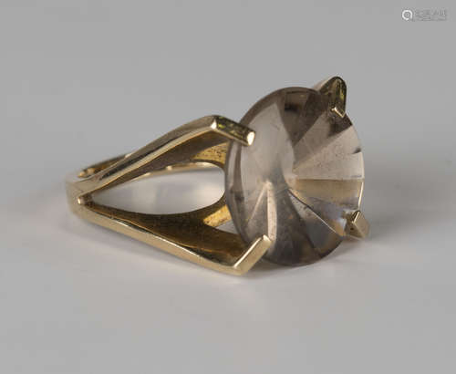 A 9ct gold ring, claw set with a circular cut smoky quartz, ring size approx L.Buyer’s Premium 29.4%