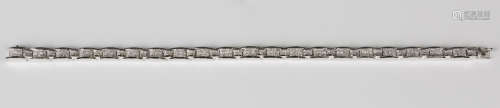 An 18ct white gold and diamond bracelet in a curved rectangular and square link design, each link