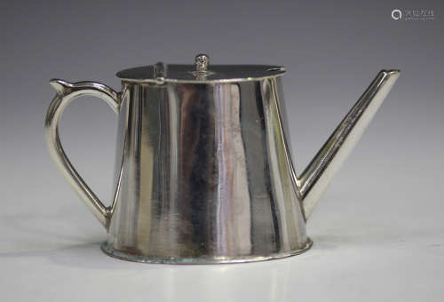 A late Victorian silver novelty mustard in the form of a conservatory watering can with hinged