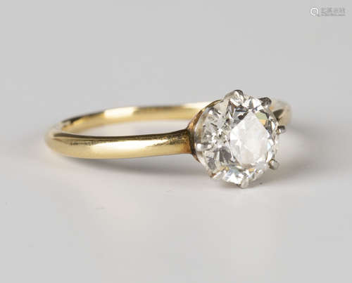 A gold and diamond single stone ring, claw set with a cushion cut diamond, ring size approx M.