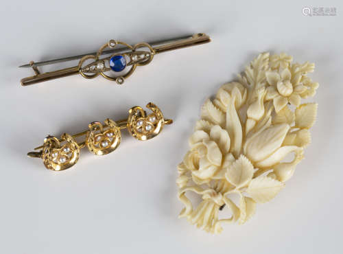 A late Victorian gold and seed pearl brooch, designed as a row of three horseshoes enclosing